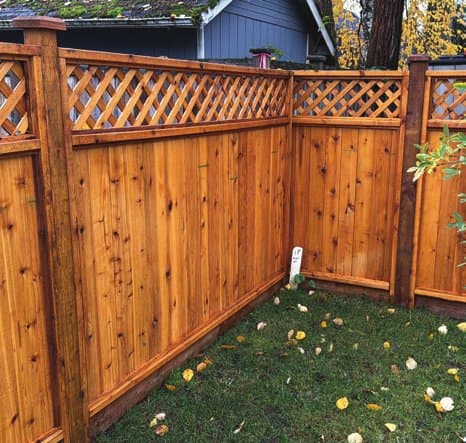 Diagonal lattice-top cedar fence panels on an installed run