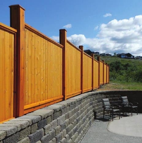 Full-privacy cedar fence run enclosing a backyard